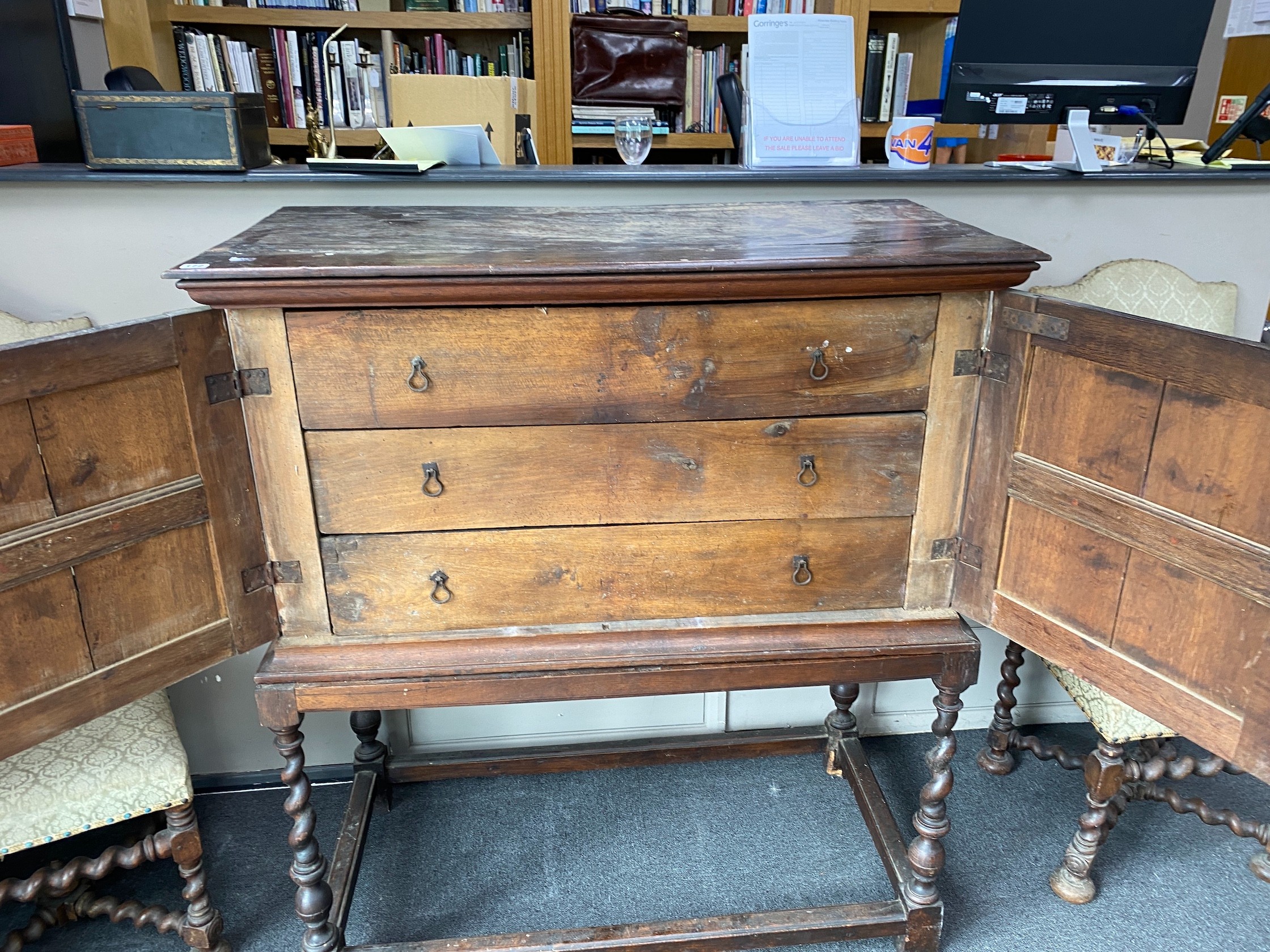 A 17th century style parquetry inlaid walnut cabinet on stand, with two doors enclosing three long drawers, width 118cm, depth 59cm, height 133cm